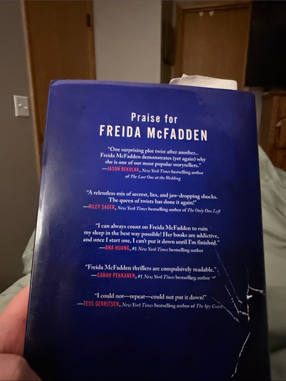Freida McFadden "The Intruder" Hardcover - Navy & Red Cover - Picture 3 of 3